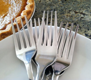 metal forks on plate for Thanksgiving dinner