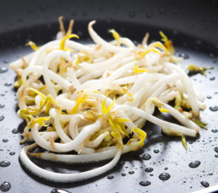Mung bean sprouts in a black pan