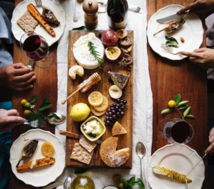 Food Policy for Canada helps make meals like this one possible. A table full of food and wine is seen from above.